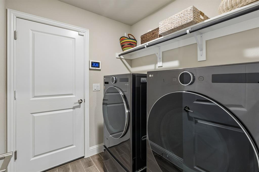 2137 Charming Frg Road Forney, TX 75126 - Photo 28 of 35 a utility room with dryer and washer
