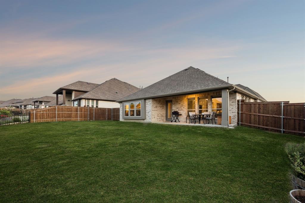 2137 Charming Frg Road Forney, TX 75126 - Photo 31 of 35 a view of a house with a yard and sitting area