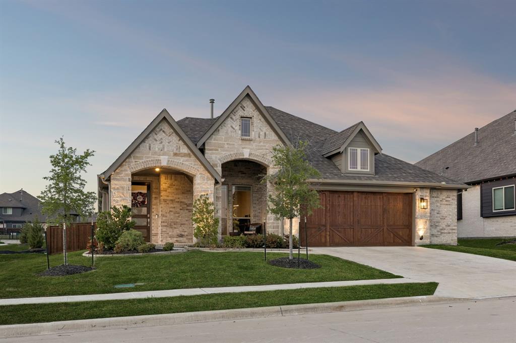 2137 Charming Frg Road Forney, TX 75126 - Photo 7 of 35 a front view of a house with a yard