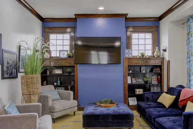 a living room with furniture and a flat screen tv