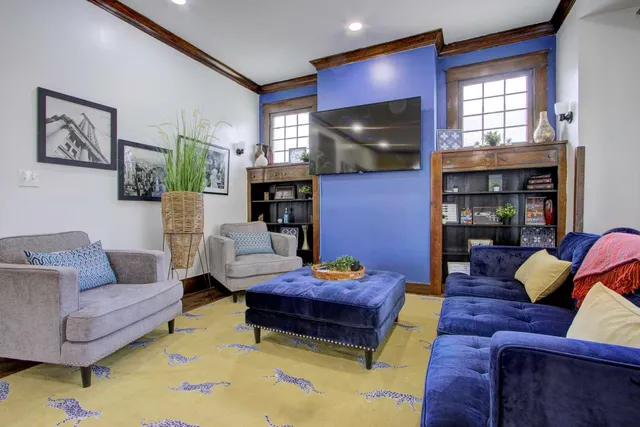 a living room with furniture and a flat screen tv