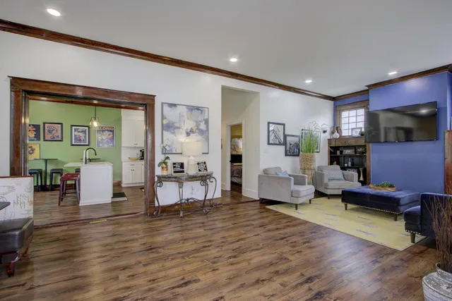a living room with furniture and a fireplace