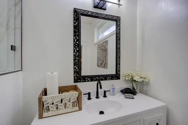 a bathroom with a sink and a mirror