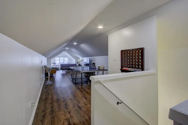 a living room with lots of furniture and wooden floors