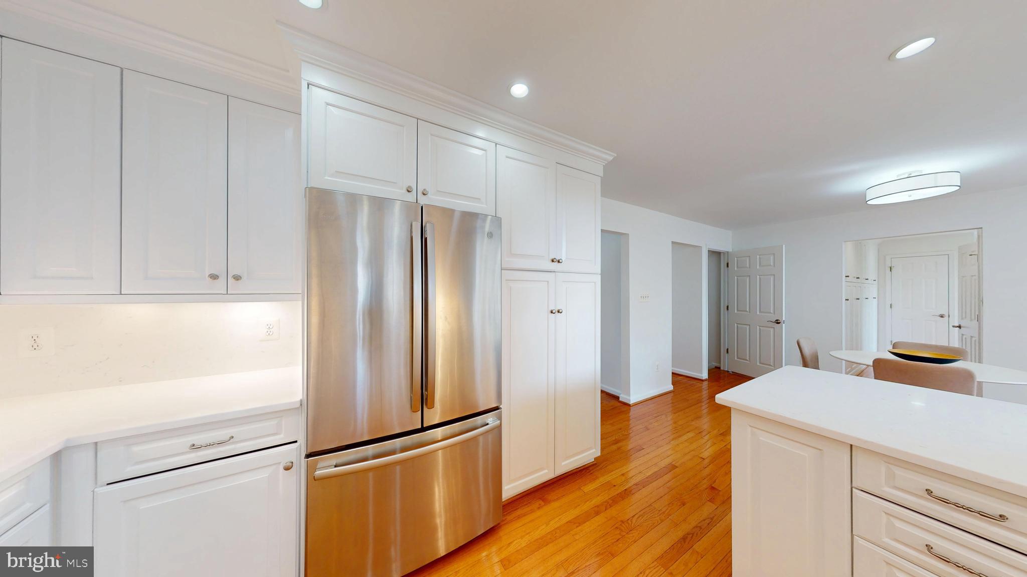 1522 Coat Ridge Road Herndon, VA 20170 - Photo 8 of 41 Kitchen with Custom Cabinetry, SS Appliances.