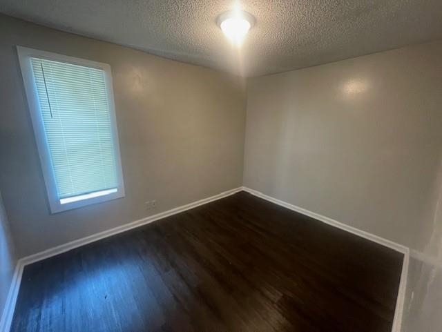 48 South Bristol Road Marion, AR 72364 - Photo 7 of 18 an empty room with wooden floor and windows