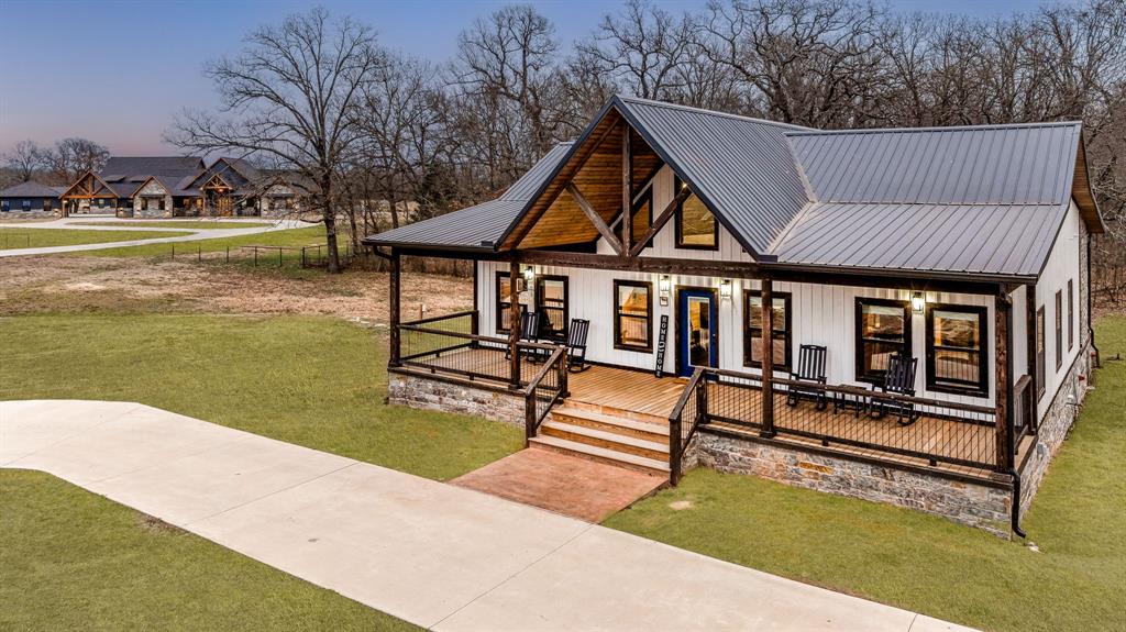 239 32507th Road Paris, TX 75460 - Photo 7 of 40 Modern inspired farmhouse with a porch, a lawn, and a metal roof
