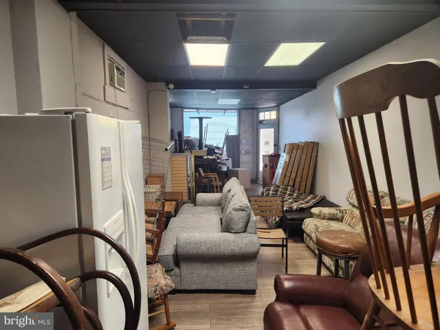 a view of a livingroom with furniture and windows