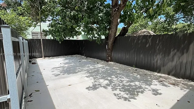 a view of backyard space and trees