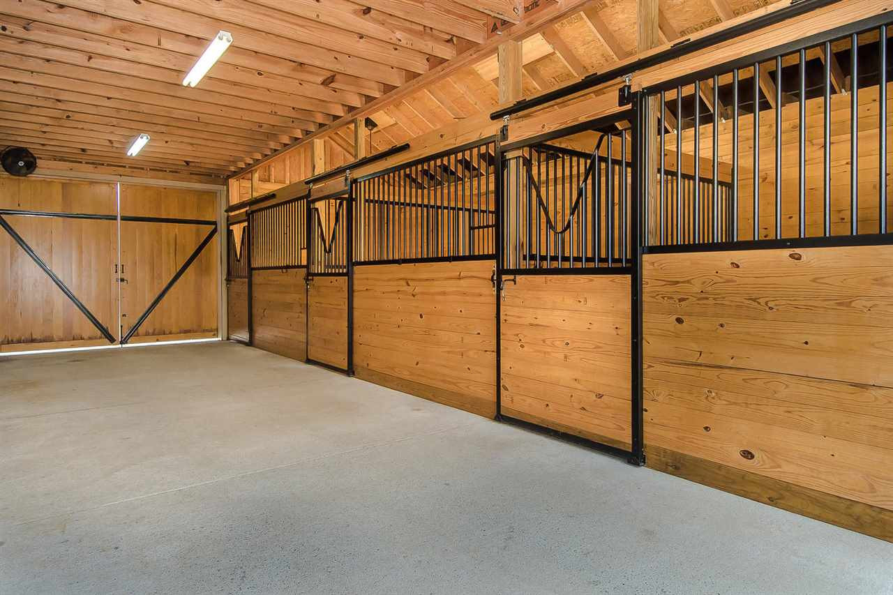 1522 Freedom Road Smithfield, NC 27577 - Photo 18 of 25 Four generous stalls. Loft with elevator. Custom finished. Shows like a million bucks! Stable/Barn