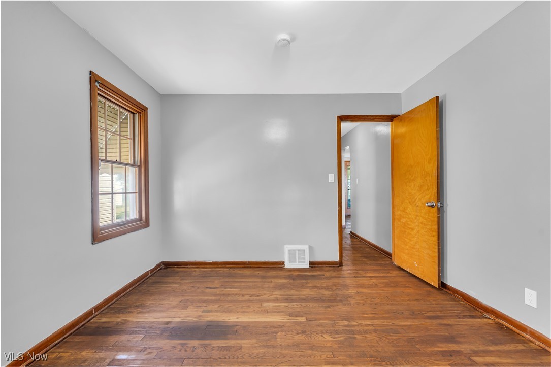 5817 Turney Road Garfield Heights, OH 44125 - Photo 14 of 31 Unfurnished room featuring dark wood-style flooring