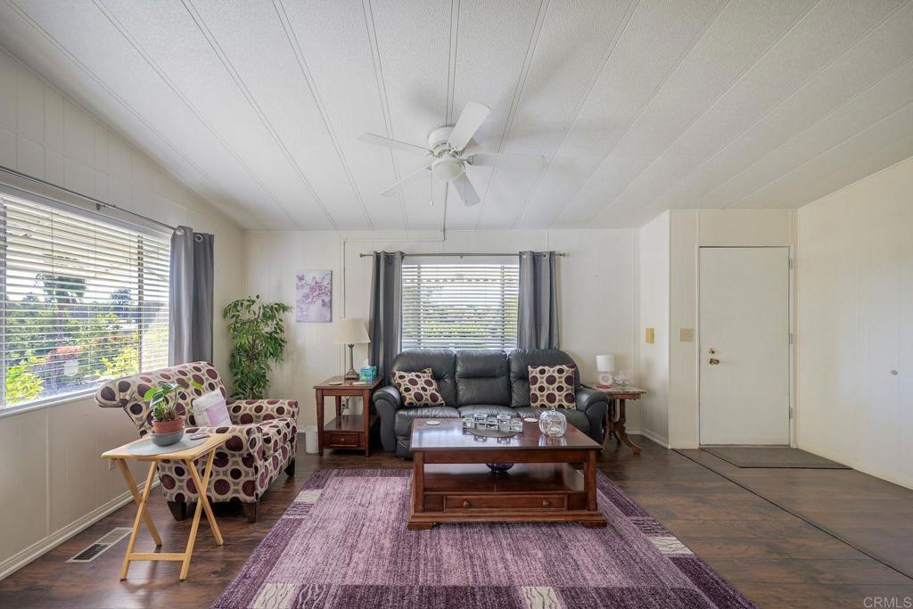18218 Paradise Mountain Road Valley Center, CA 92082 - Photo 13 of 34 a living room with furniture and a window