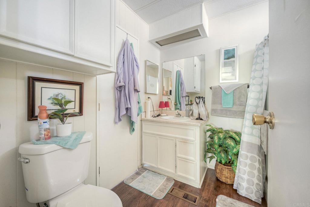 18218 Paradise Mountain Road Valley Center, CA 92082 - Photo 20 of 34 a bathroom with a sink toilet and shower