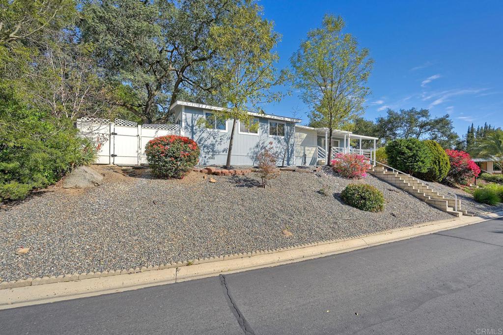 18218 Paradise Mountain Road Valley Center, CA 92082 - Photo 2 of 34 a view of a street with some trees
