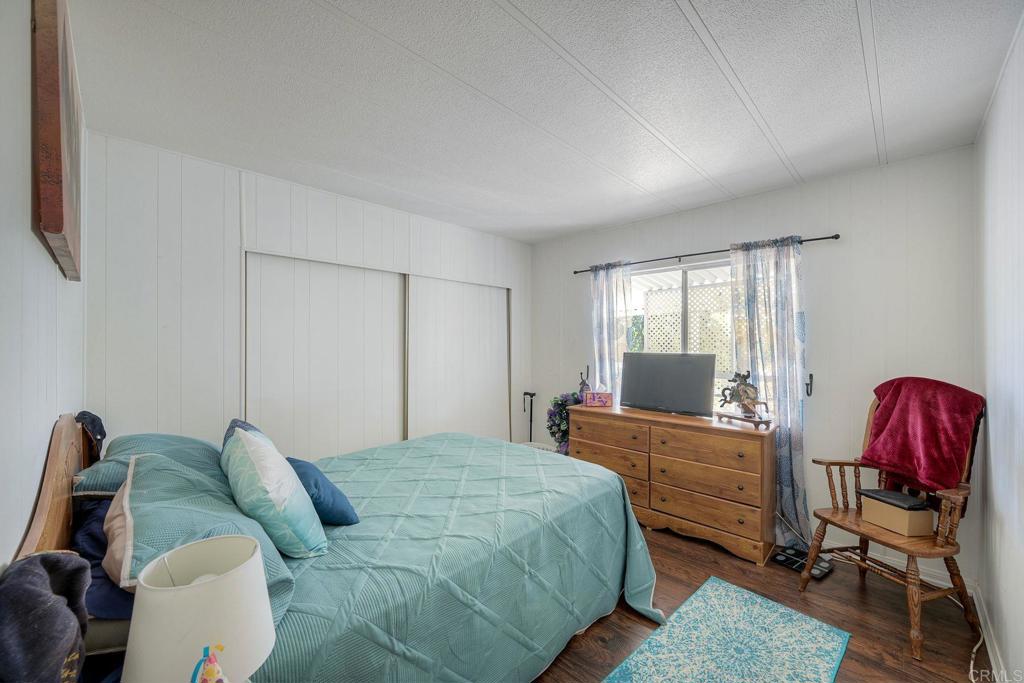 18218 Paradise Mountain Road Valley Center, CA 92082 - Photo 21 of 34 a bedroom with a bed and window