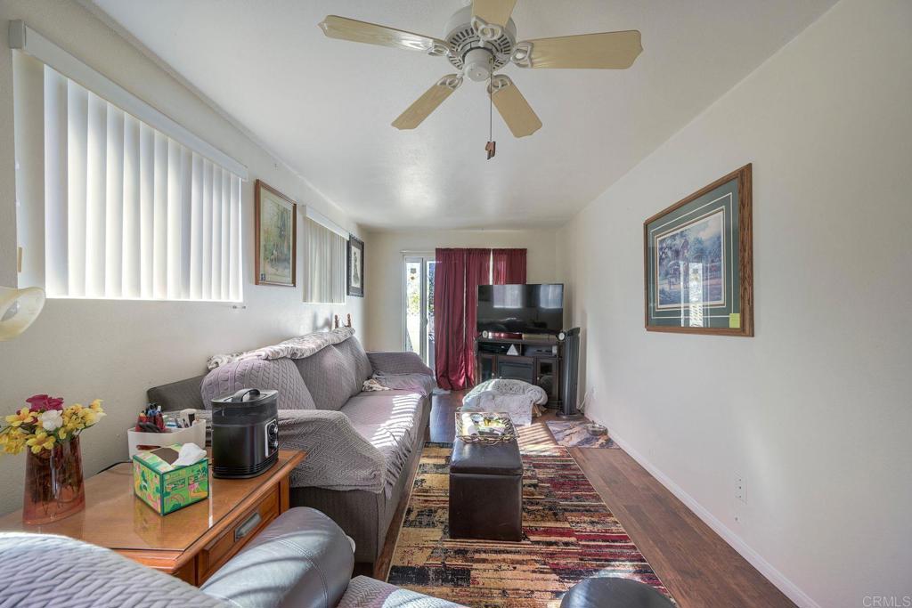 18218 Paradise Mountain Road Valley Center, CA 92082 - Photo 29 of 34 a living room with furniture and wooden floor