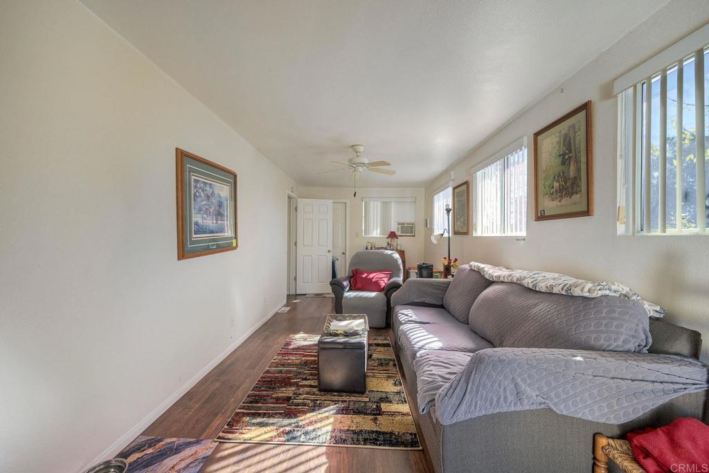 18218 Paradise Mountain Road Valley Center, CA 92082 - Photo 30 of 34 a living room with furniture and a window