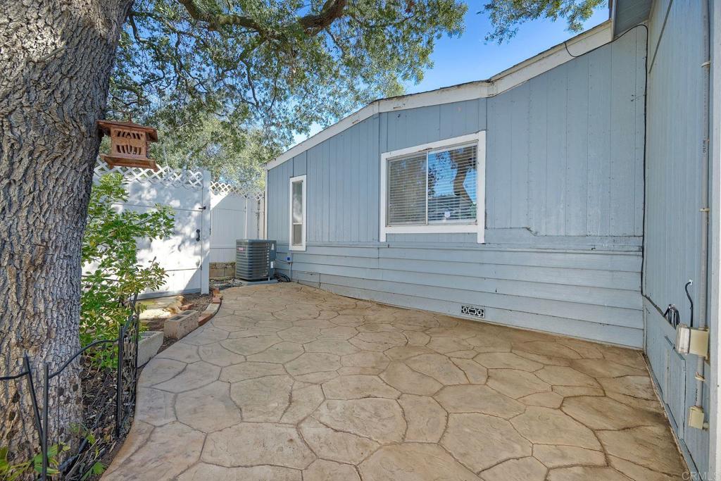 18218 Paradise Mountain Road Valley Center, CA 92082 - Photo 32 of 34 a backyard of a house with lots of green space