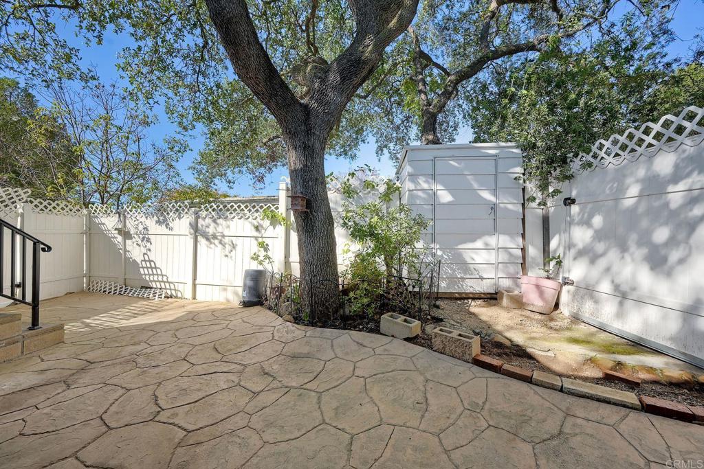 18218 Paradise Mountain Road Valley Center, CA 92082 - Photo 33 of 34 a pathway of a house with a trees