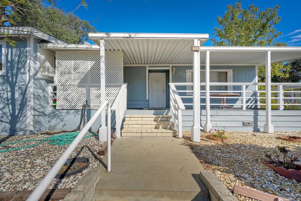 18218 Paradise Mountain Road Valley Center, CA 92082 - Photo 4 of 34 front view of a house with a yard
