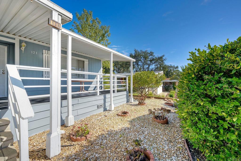 18218 Paradise Mountain Road Valley Center, CA 92082 - Photo 5 of 34 a view of a house with backyard and sitting area