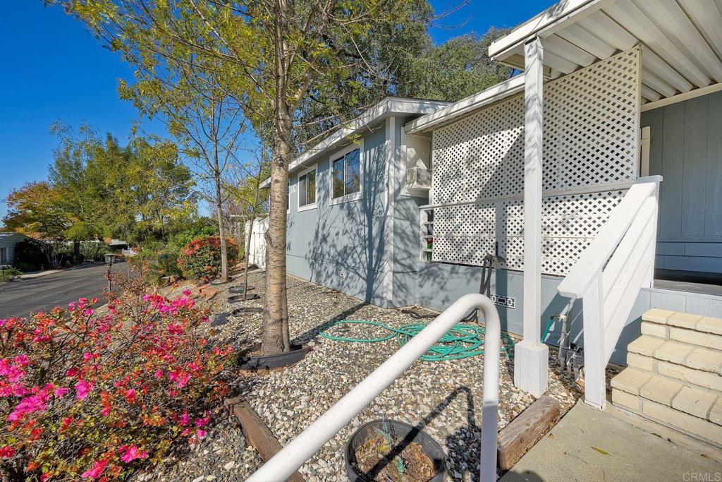 18218 Paradise Mountain Road Valley Center, CA 92082 - Photo 6 of 34 a front view of a house with a yard