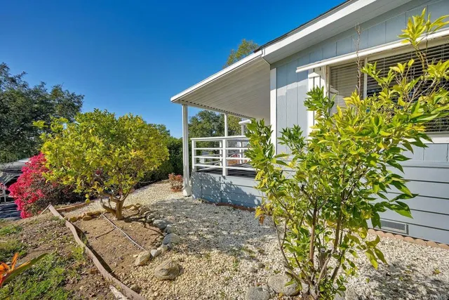 a view of a house with a garden