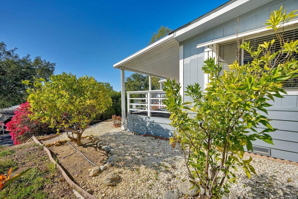 18218 Paradise Mountain Road Valley Center, CA 92082 - Photo 7 of 34 a view of a house with a garden