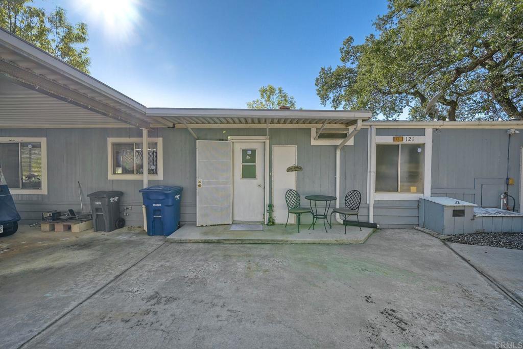 18218 Paradise Mountain Road Valley Center, CA 92082 - Photo 10 of 34 a view of a chairs and table in a room