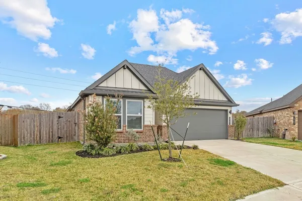 a kitchen with stainless steel appliances granite countertop a refrigerator stove top oven and sink