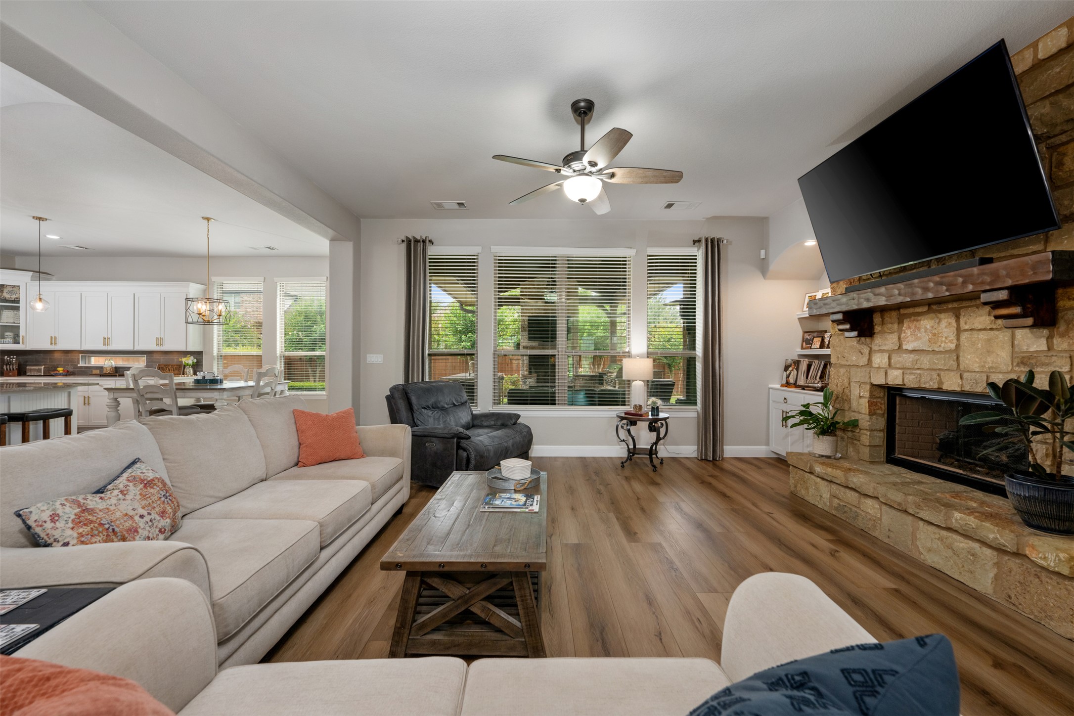 3021 Wedgescale Pass Leander, TX 78641 - Photo 6 of 40 a living room with furniture and a flat screen tv