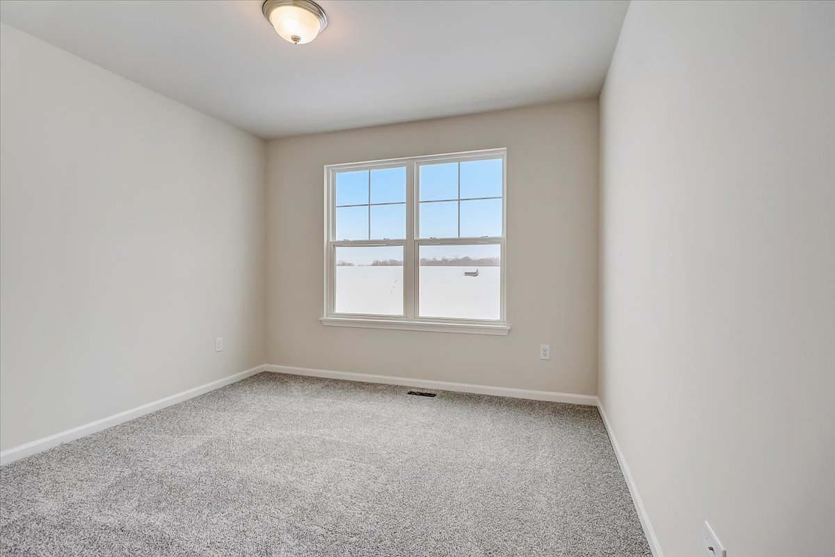 715 Station Boulevard Elburn, IL 60119 - Photo 24 of 33 an empty room with a window