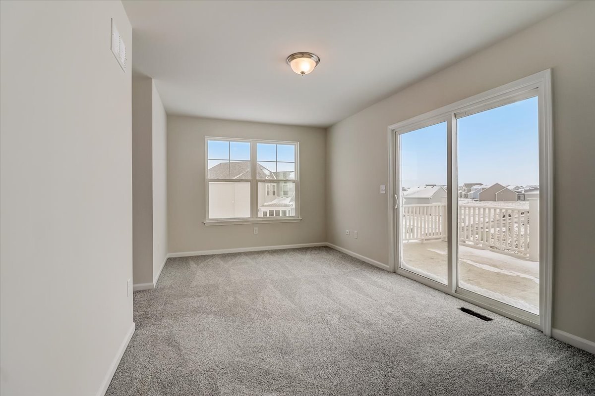 715 Station Boulevard Elburn, IL 60119 - Photo 27 of 33 an empty room with windows and closet