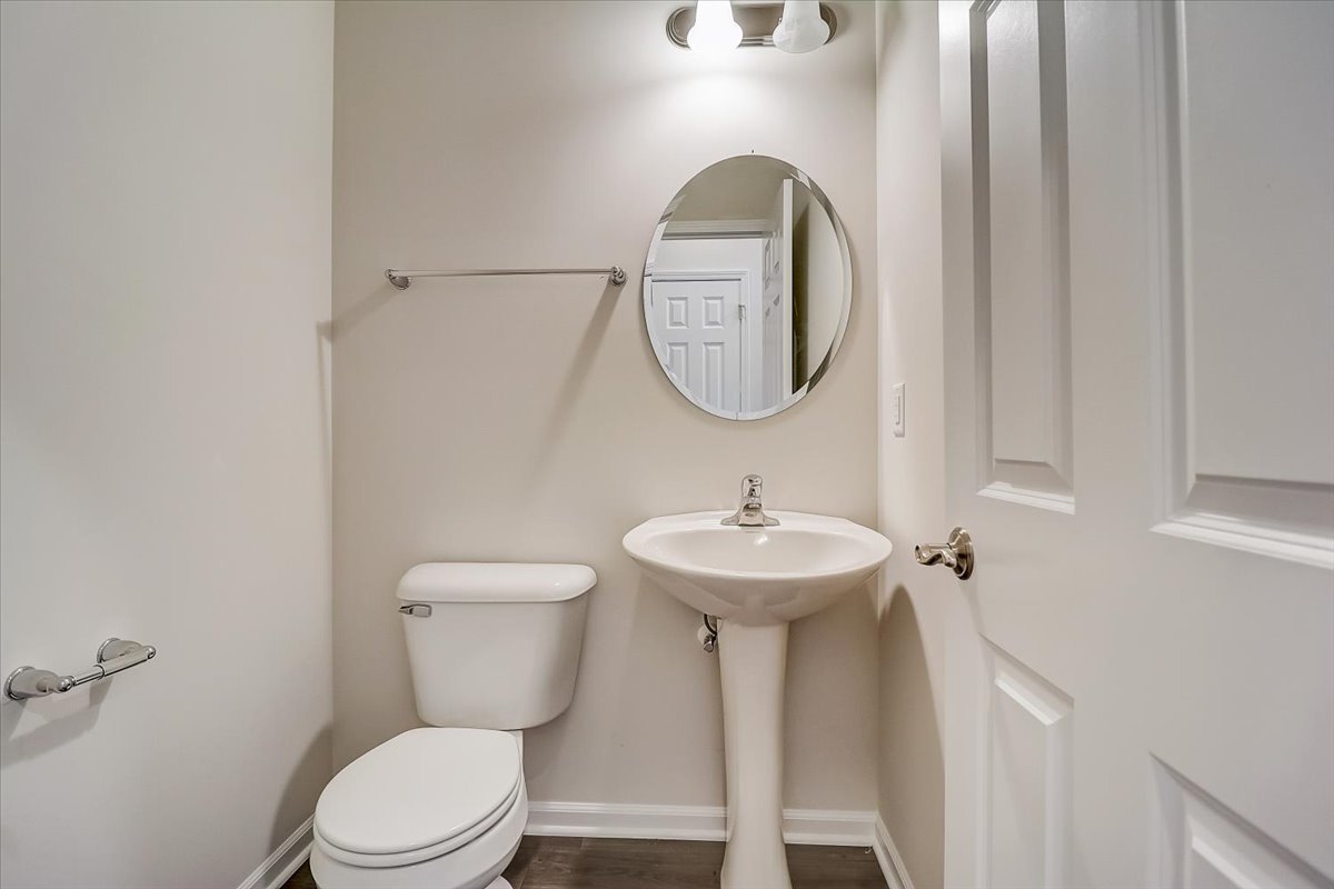 715 Station Boulevard Elburn, IL 60119 - Photo 28 of 33 a bathroom with a toilet sink and mirror