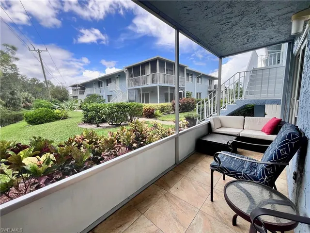 a view of an chairs and tables in the balcony