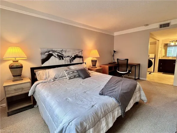 a bedroom with bed and window