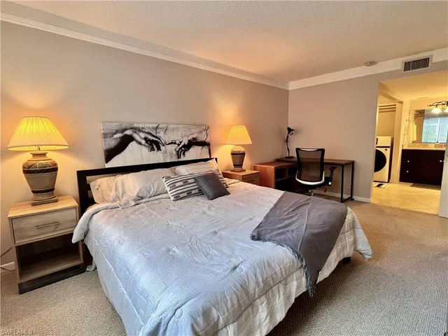 a bedroom with bed and window