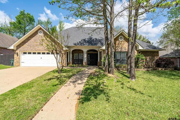 a view of a backyard with sitting area