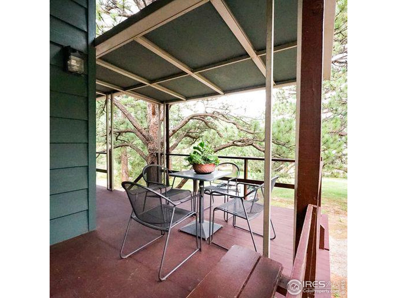 44 Cheyenne Road Lyons, CO 80540 - Photo 7 of 35 Front deck with covered seating area. Brand new metal roof over this section in 2021.