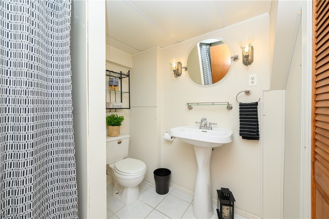 5304 Sibila Road Northwest Canton, OH 44718 - Photo 29 of 29 Bathroom with toilet, tile floors, and sink