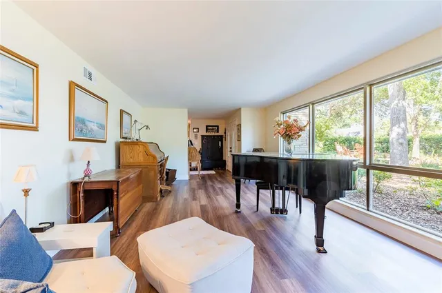 a view of a livingroom with furniture and a flat screen tv