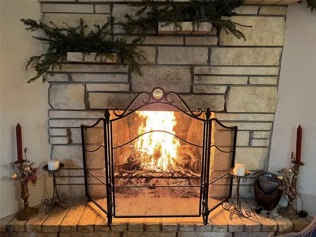 a kitchen with kitchen island a wooden table and chairs
