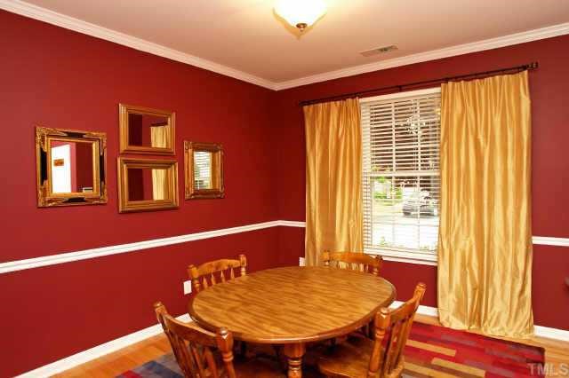 8322 City Loft Court Raleigh, NC 27613 - Photo 7 of 12 a view of a dining room with furniture and window