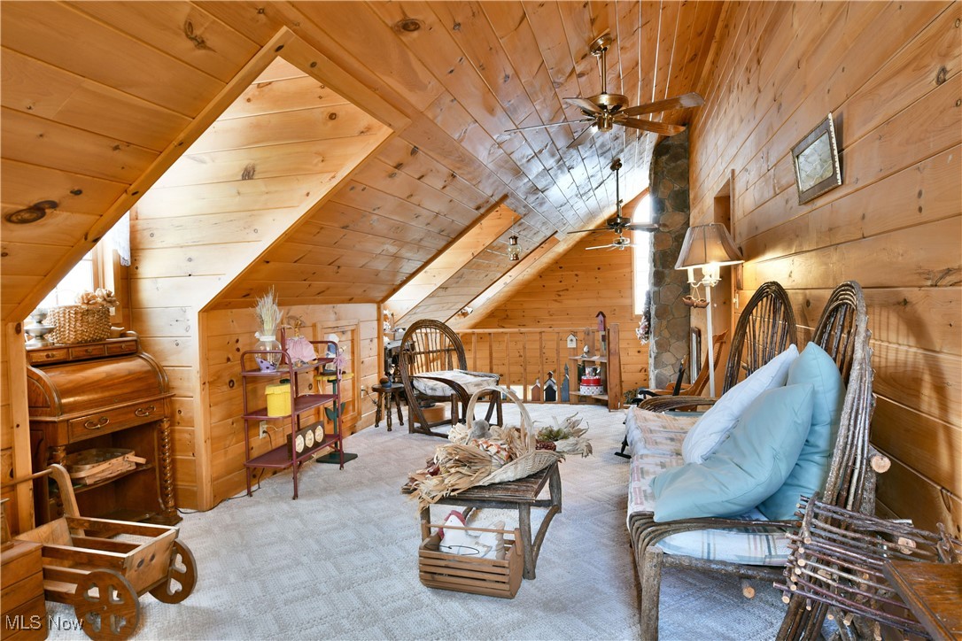 3339 Bushnell Campbell Road Fowler, OH 44418 - Photo 32 of 50 Sitting room with wood walls, carpet flooring, wood ceiling, a ceiling fan, and vaulted ceiling
