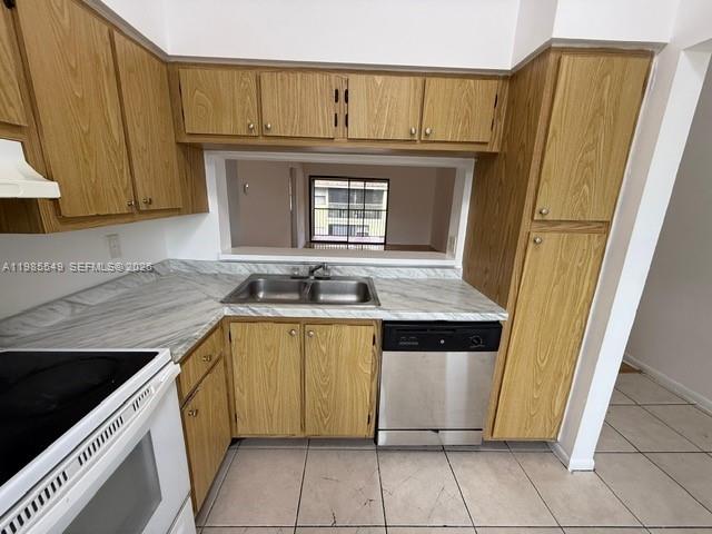 2255 Southwest 80th Terrace, Unit 2255 Miramar, FL 33025 - Photo 11 of 14 a view of a kitchen with fridge and wooden floor