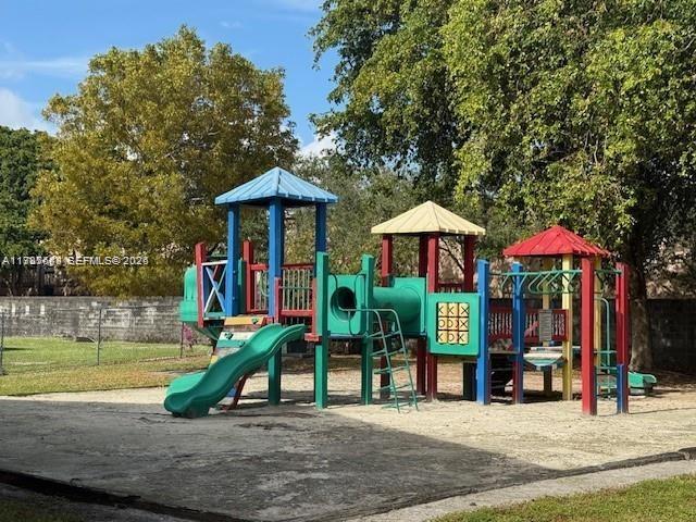 2255 Southwest 80th Terrace, Unit 2255 Miramar, FL 33025 - Photo 14 of 14 a view of a park with swings and slides