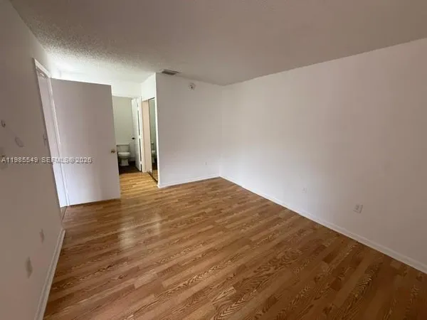 a bathroom with a double vanity sink and mirror