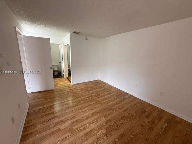 2255 Southwest 80th Terrace, Unit 2255 Miramar, FL 33025 - Photo 6 of 14 a view of empty room with wooden floor