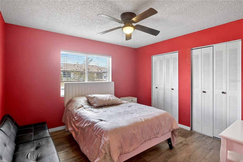 622 Ridge Terrace Winter Haven, FL 33881 - Photo 13 of 34 a bedroom with a bed and a window