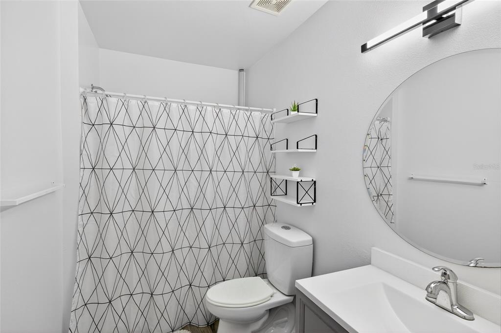 622 Ridge Terrace Winter Haven, FL 33881 - Photo 15 of 34 a bathroom with a toilet and sink